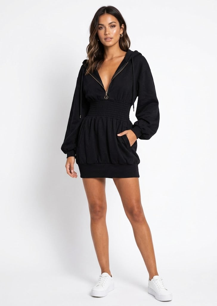 Brielle hooded mini dress in black styled with white sneakers, front view