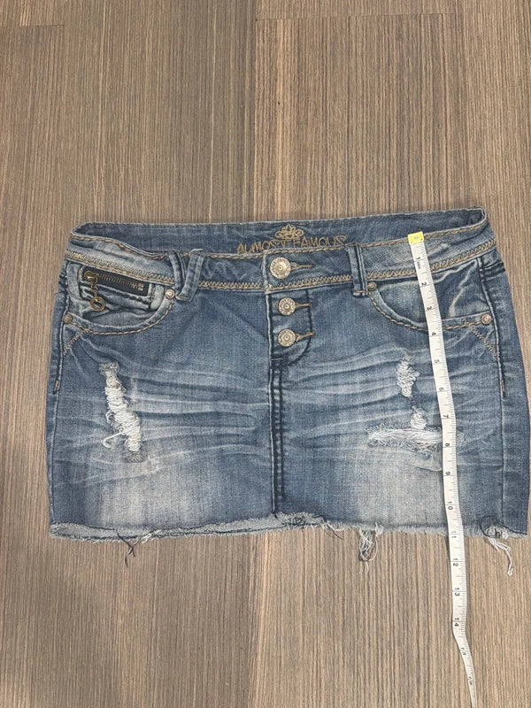 Almost Famous distressed denim micro mini skirt, front view with tape measure for length