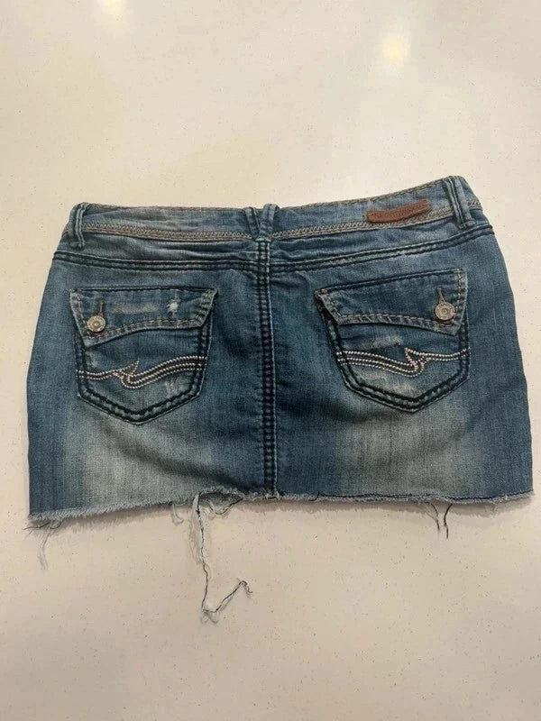 Almost Famous distressed denim micro mini skirt, back view with raw hem