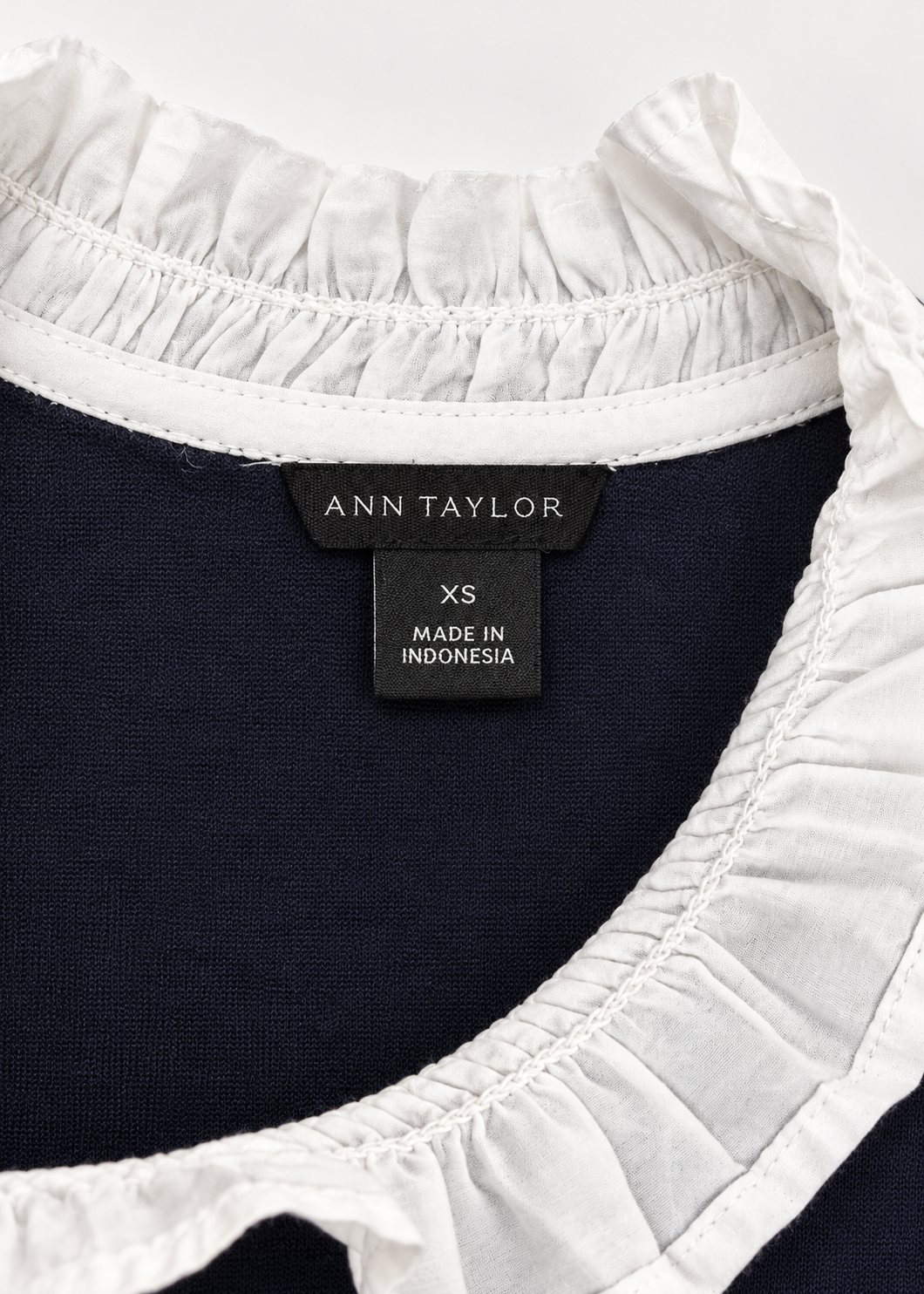 Ann Taylor size XS label and white ruffled neckline detail
