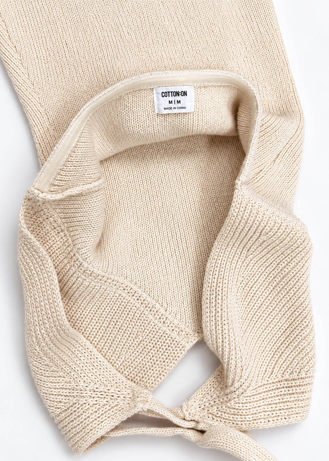 Interior knit and Cotton On size M label of cream halter mini dress
