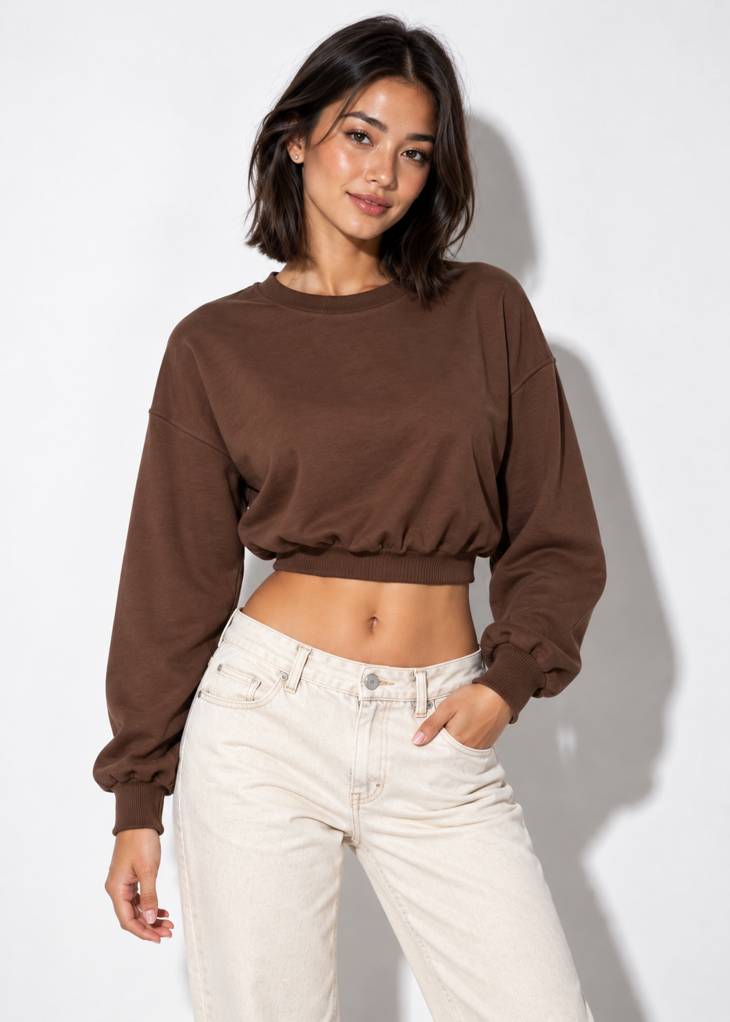 Keely cropped sweatshirt in brown, front view styled with ecru jeans