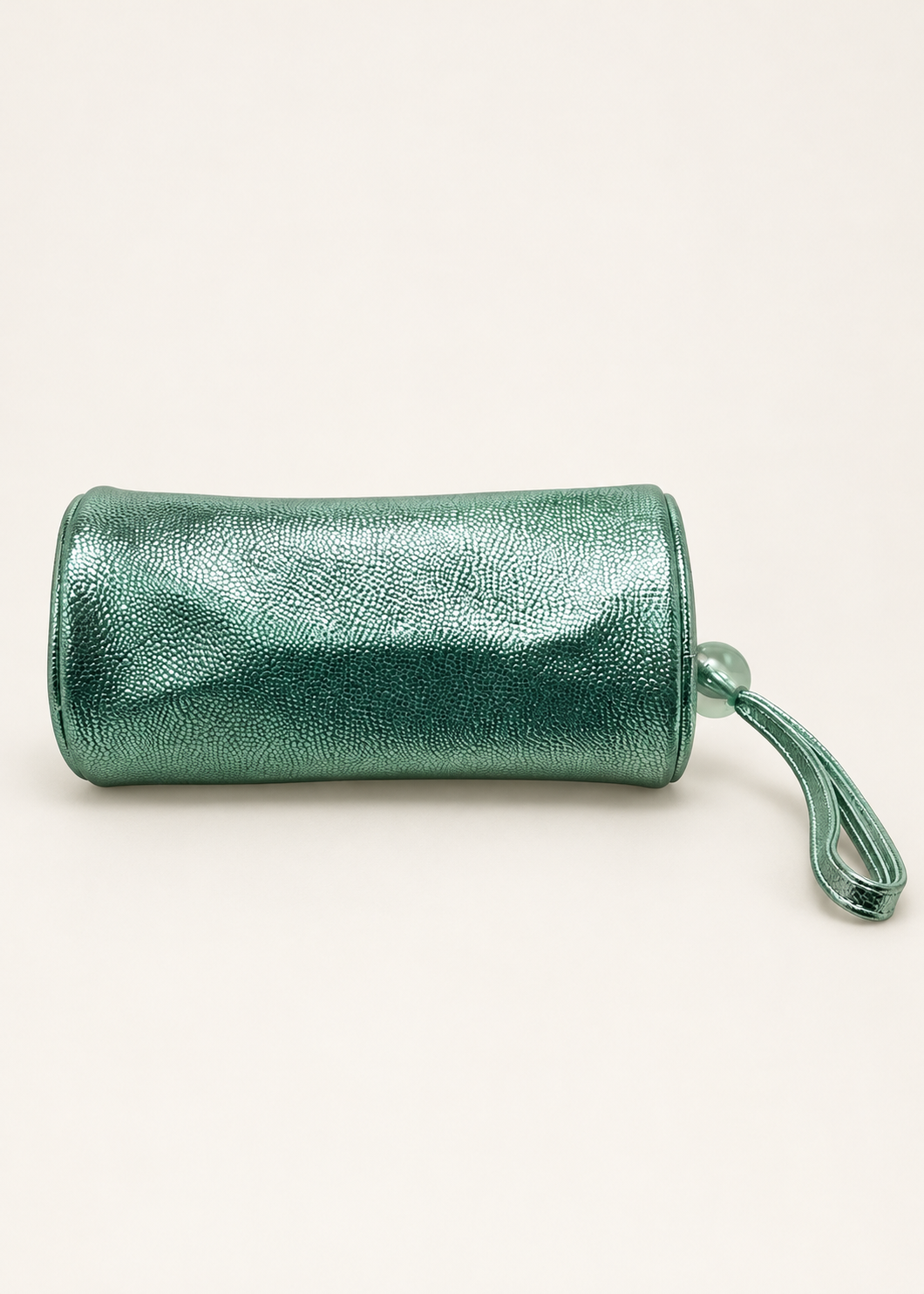 MAC mint green metallic barrel makeup bag, back view with wrist strap