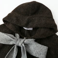 Close-up of the hood and oversized gray bow on the Cecily dark brown cardigan