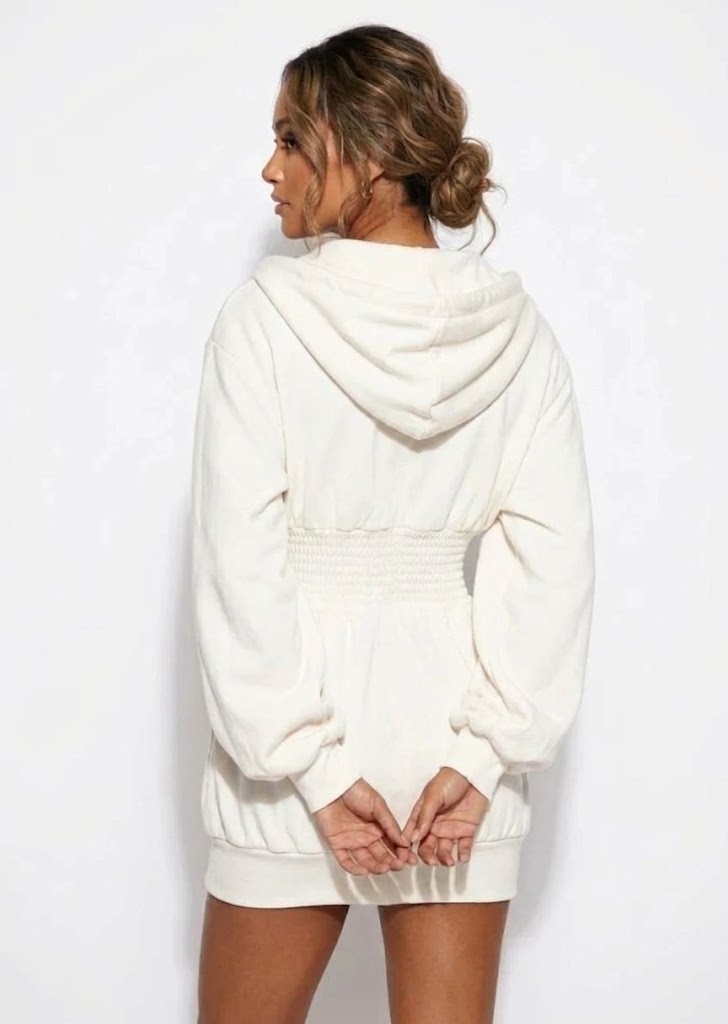 Brielle hooded mini dress in white with zip front and smocked waist, front view