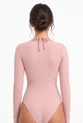 Back view of the pink Cielle bodysuit showing the halter neck tie