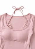 Close-up of the pink Cielle bodysuit neckline with lace halter and tie