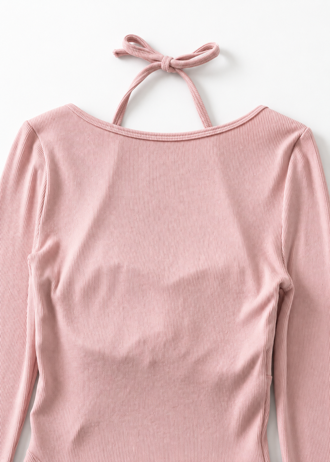 Back neckline detail of the pink Cielle ribbed bodysuit with halter bow