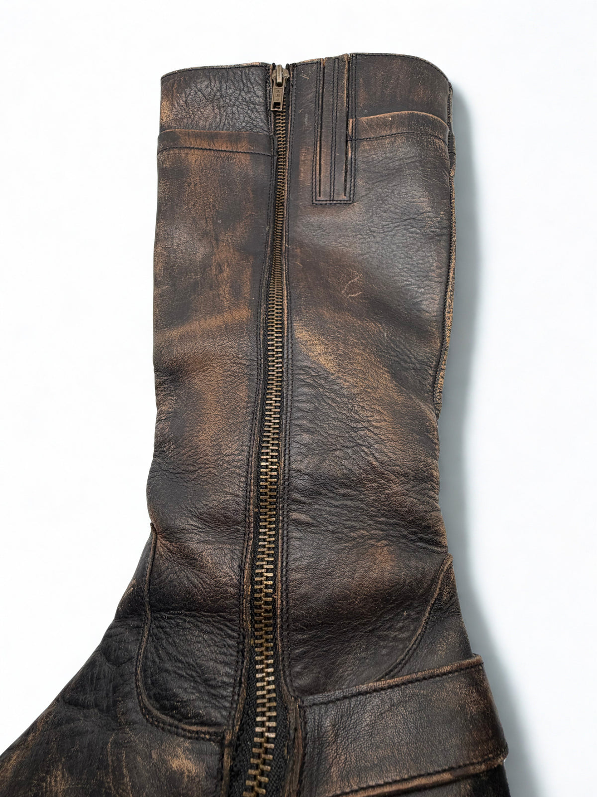 Close-up of Matisse tall leather boot zipper and distressed shaft