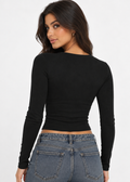 Back view of the Landon black long-sleeve top, showing its fitted cropped shape.