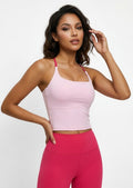 Tavi cross-back tank top in pink styled with pink leggings, front view