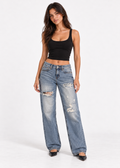 Model wearing Aéropostale light blue distressed low rise baggy jeans