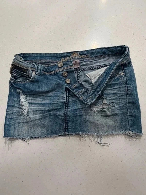 Almost Famous distressed denim micro mini skirt, front view with button fly open