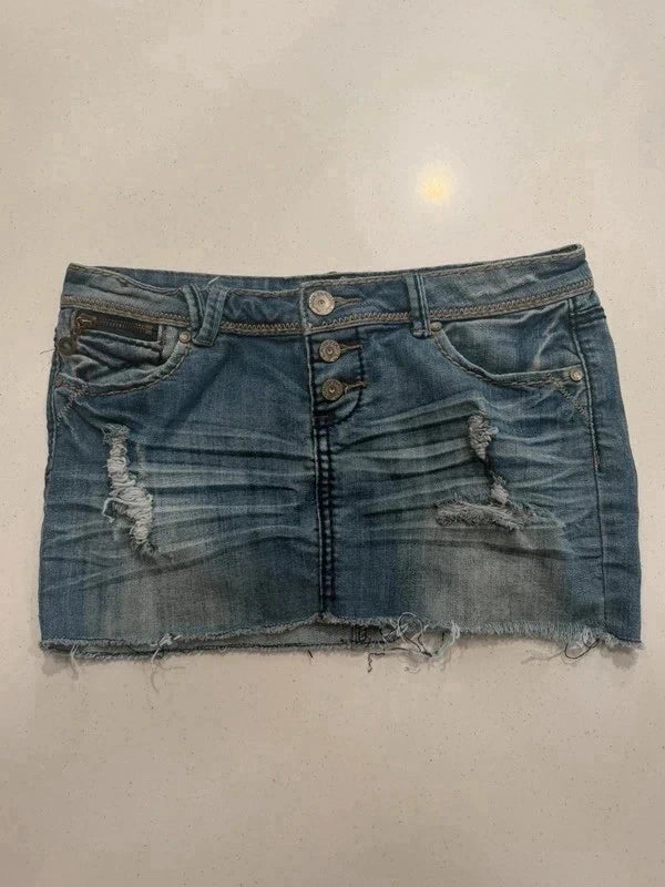 Almost Famous distressed denim micro mini skirt, front view with distressing and raw hem
