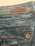 Almost Famous distressed denim micro mini skirt, brand patch and back pocket button