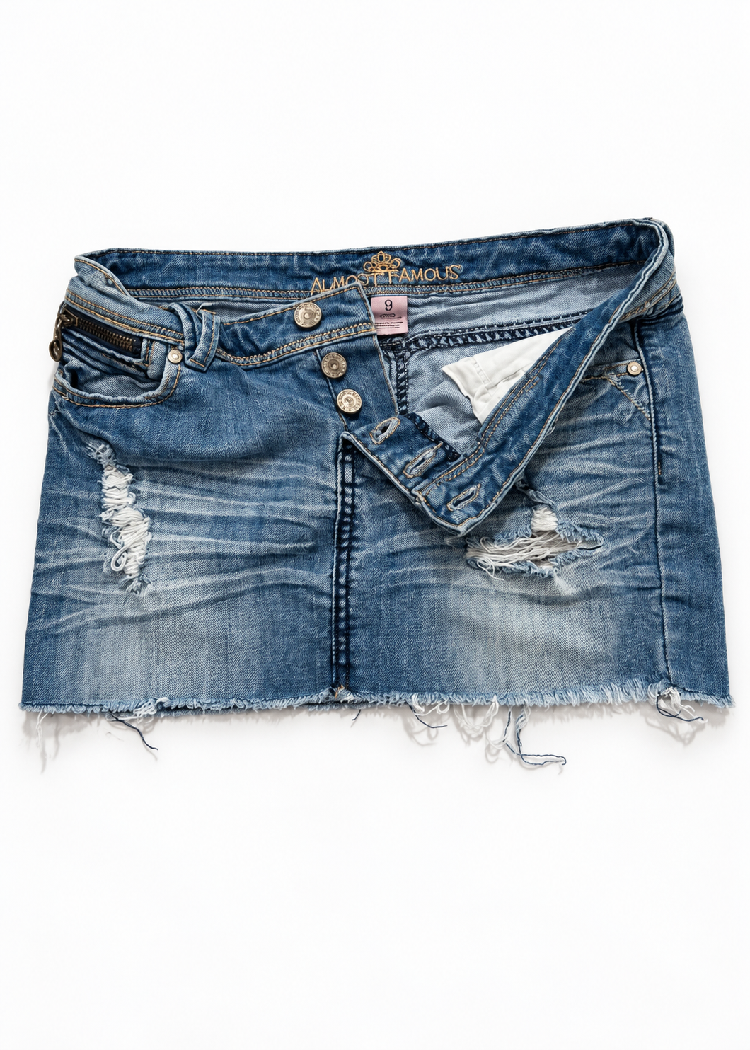 Almost Famous denim micro mini skirt showing open button fly, distressed denim and raw hem