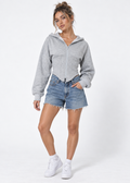 Cropped zip corset hoodie in grey styled with denim shorts and white sneakers