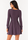 Back view of Daisy Fuentes purple metallic ribbed mini dress on a model
