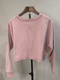 Gilly Hicks pink cropped graphic sweatshirt, back view on hanger