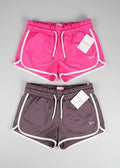Juicy Couture Sport dolphin shorts in Fierce Love pink and Moonscape gray, front view