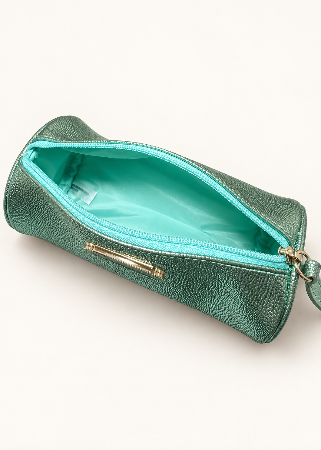 MAC mint green metallic barrel makeup bag, front view with wrist strap