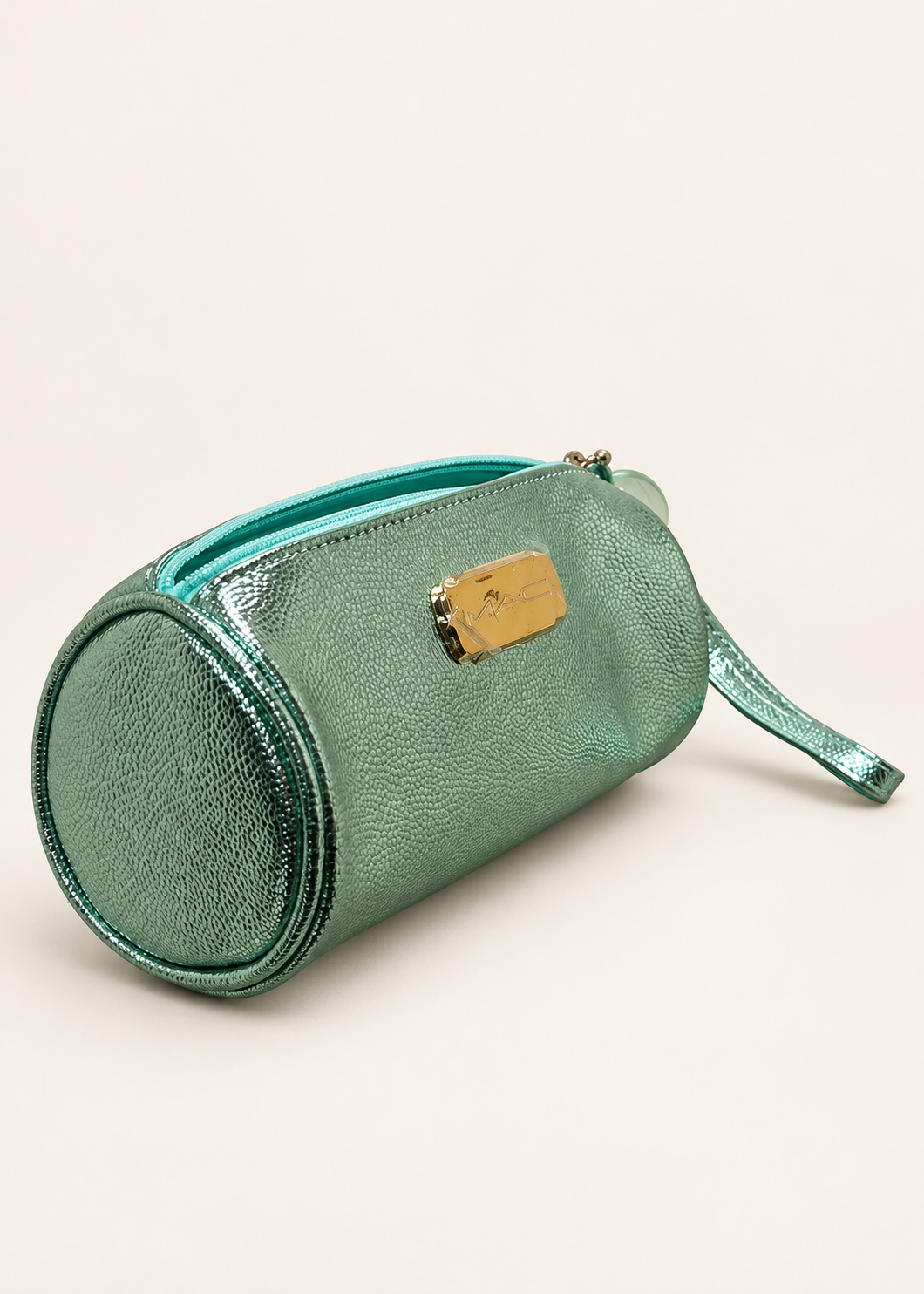MAC mint green metallic barrel makeup bag, side angle
