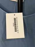 Mercantile silk layered hem blouse retail tag