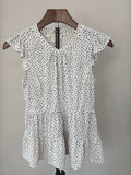 Monteau polka dot peplum top on hanger, front view