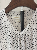 Monteau polka dot peplum top, neckline with brand label