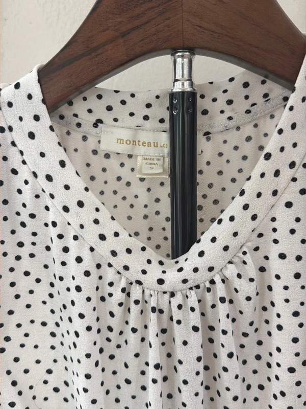 Monteau polka dot peplum top, neckline with brand label