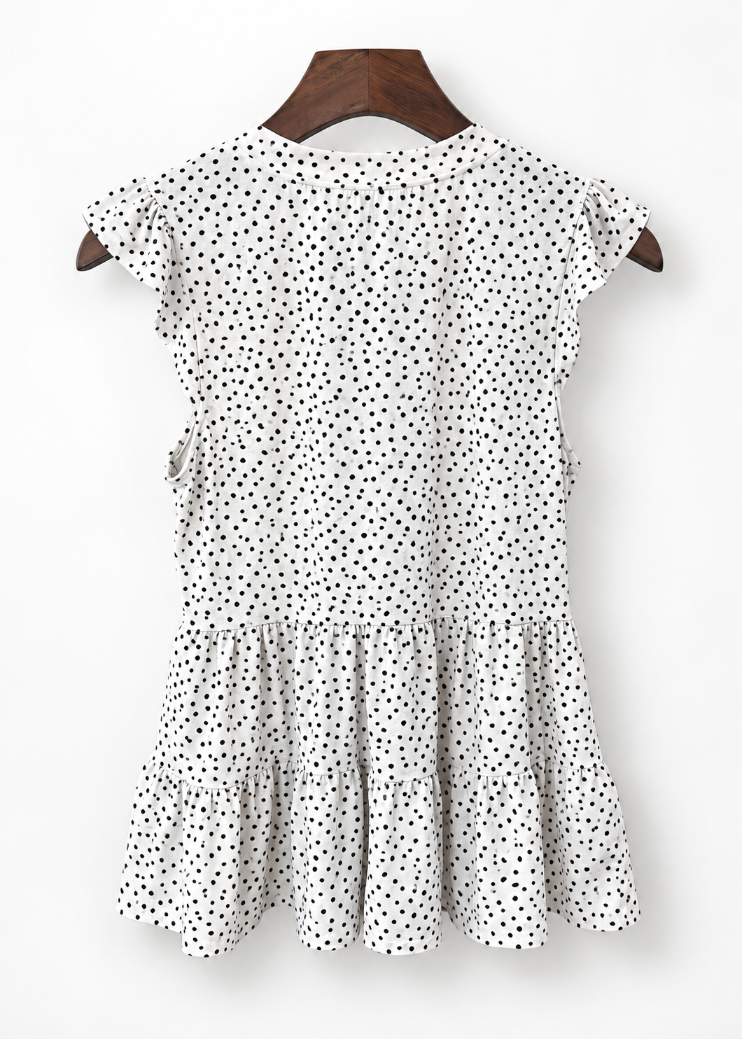 Monteau polka dot peplum top on hanger, back