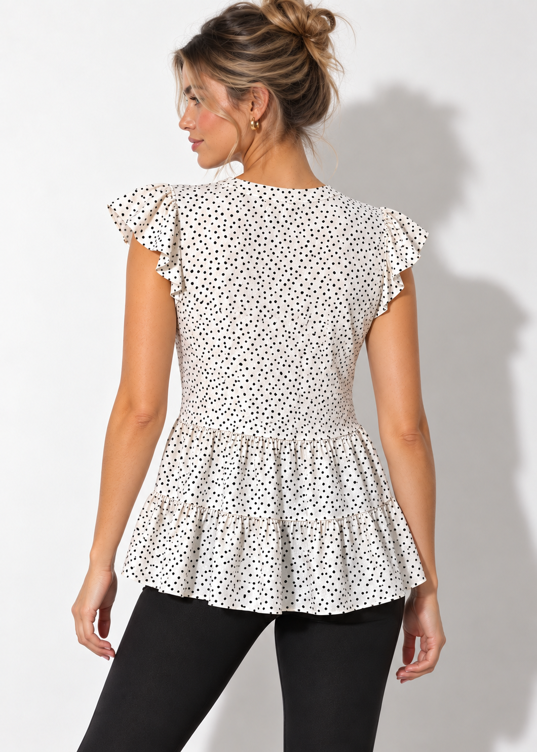 Monteau polka dot peplum top with black leggings, front view