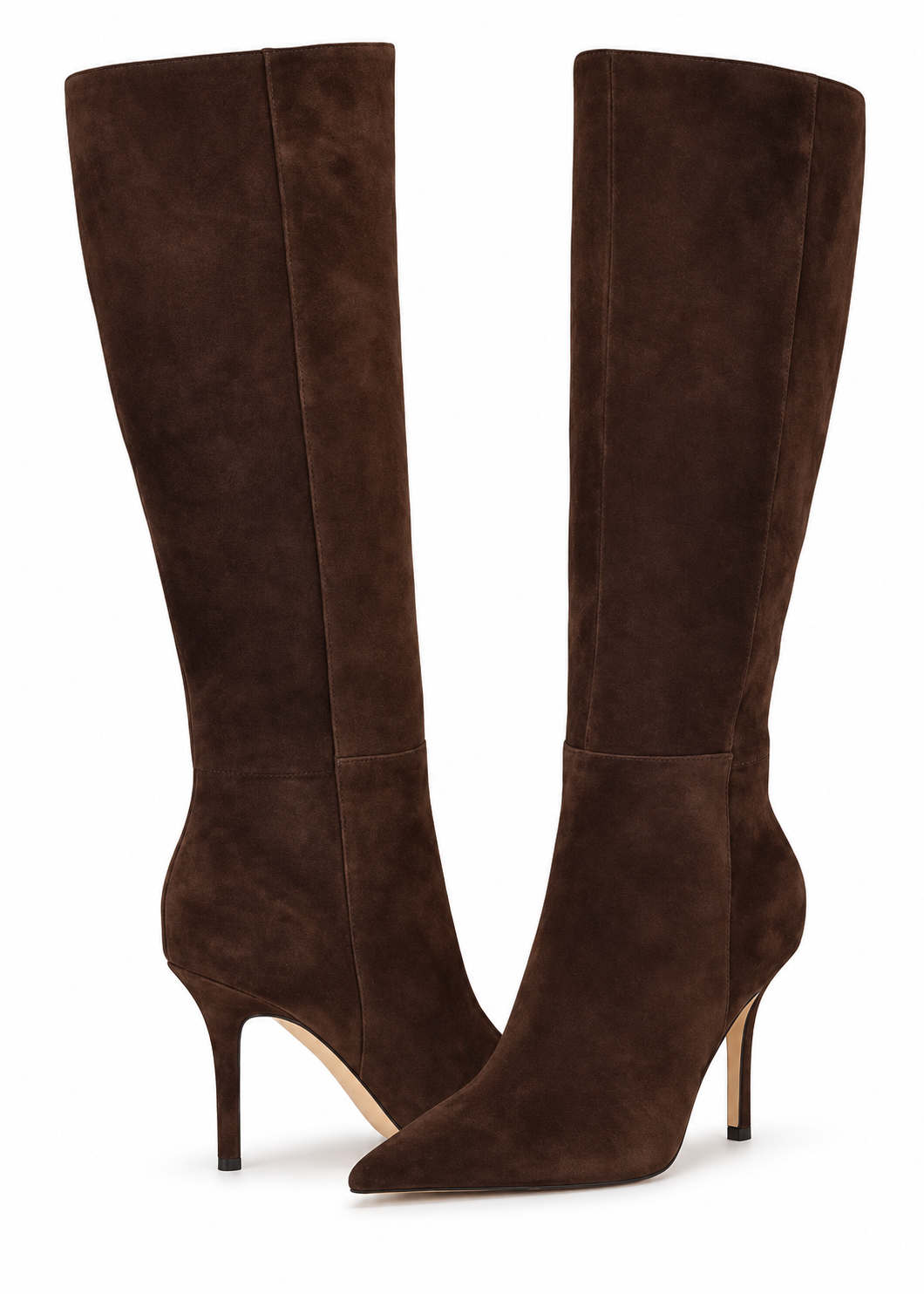 Model wearing Nine West Gerty dark brown suede boots in a white studio