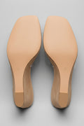 Soles of Oakmoo wedge mule sandals showing women’s size 9