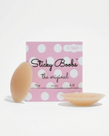 Sticky Boobs adhesive nipple covers in tan, cup size A-B, beside the polka dot box