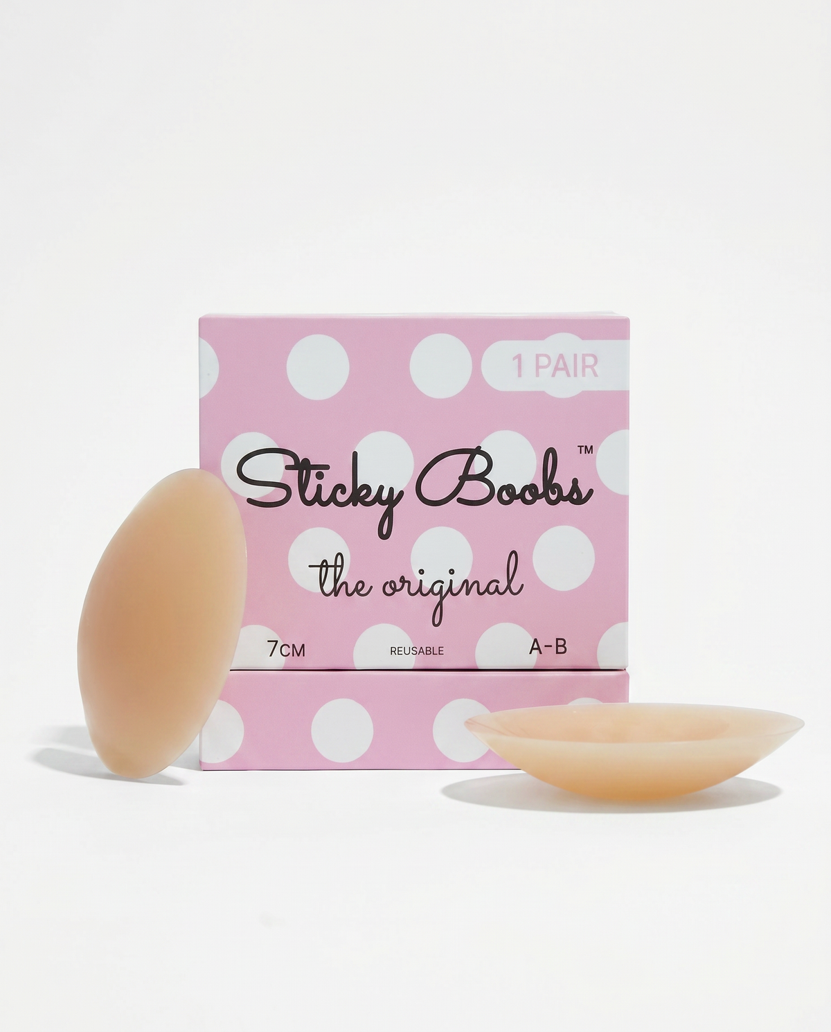 Sticky Boobs adhesive nipple covers in tan, cup size A-B, beside the polka dot box