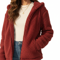 Red sherpa jacket worn by a person on a white background
