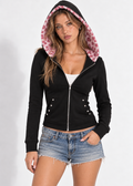 Roxie black zip-up hoodie with pink leopard-lined hood up and denim shorts