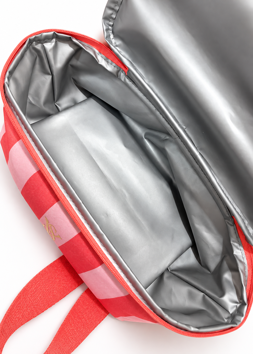 Victoria's Secret coral pink striped cooler backpack, close-up of insulated cooler lining